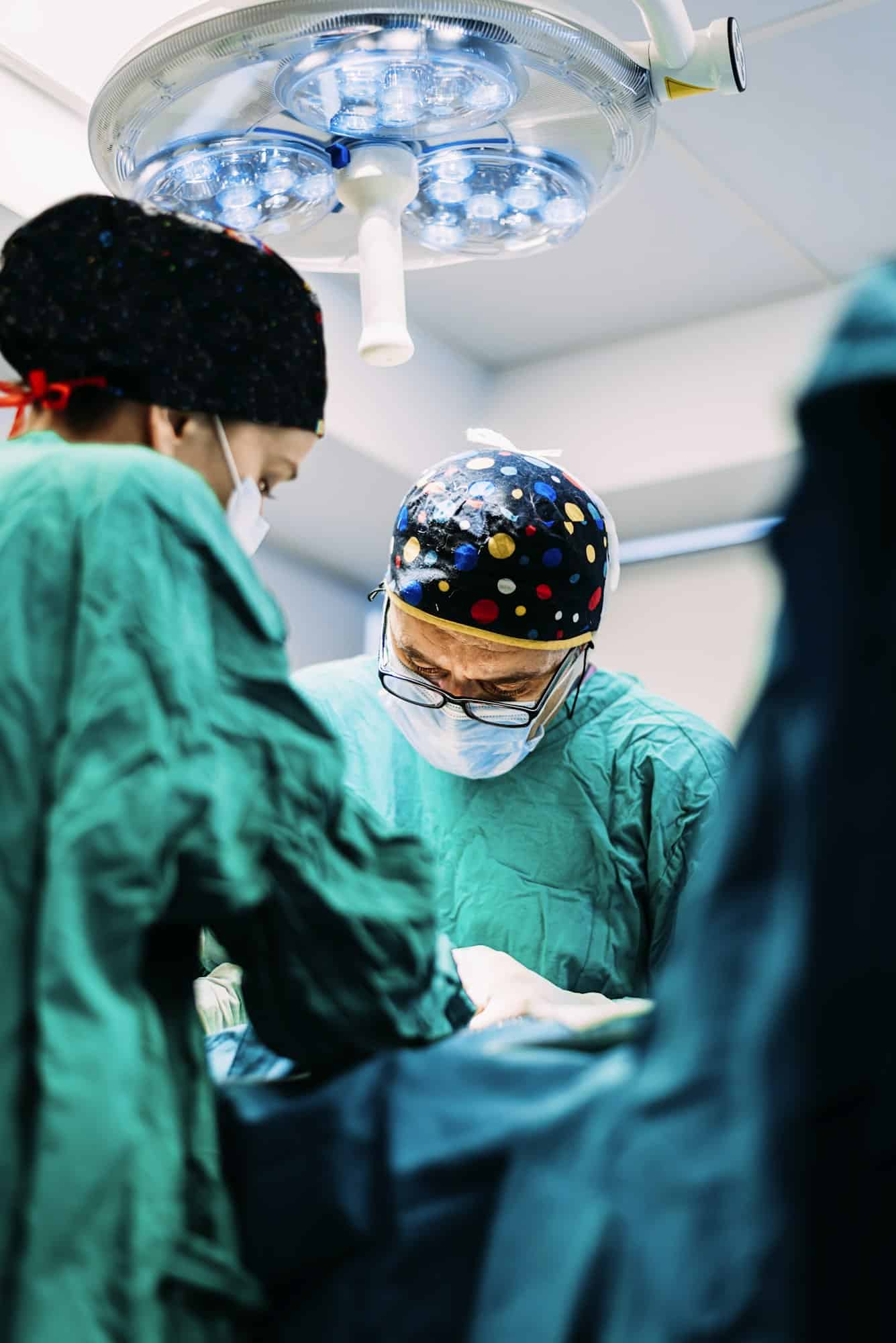 Team of Surgeons Operating in the Hospital.